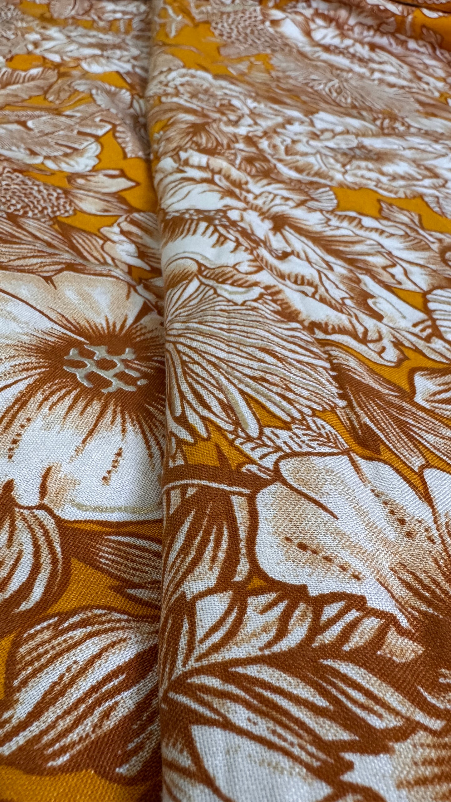 Close-up of fabric with brown floral pattern