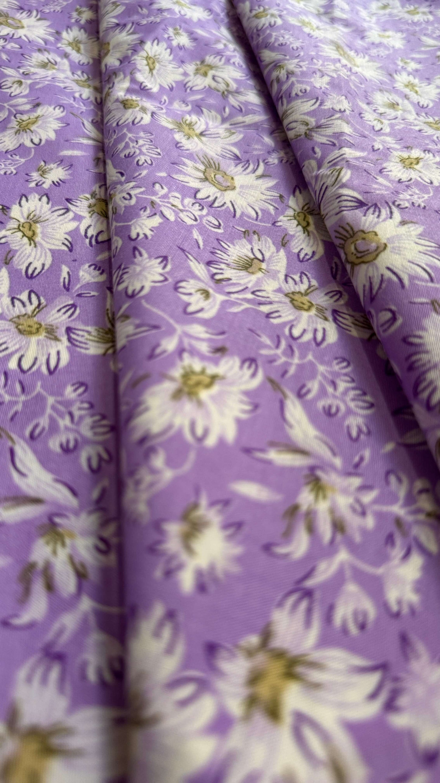 Floral pattern on purple fabric