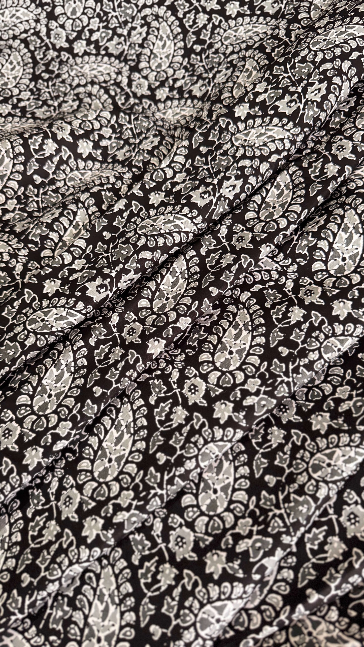 Close-up of black and white paisley pattern fabric