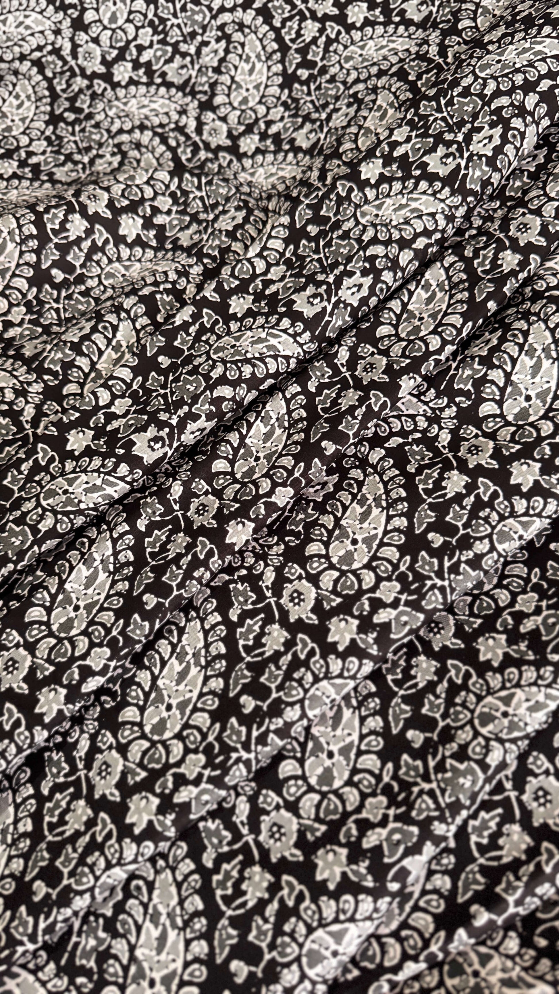 Close-up of black and white paisley pattern fabric