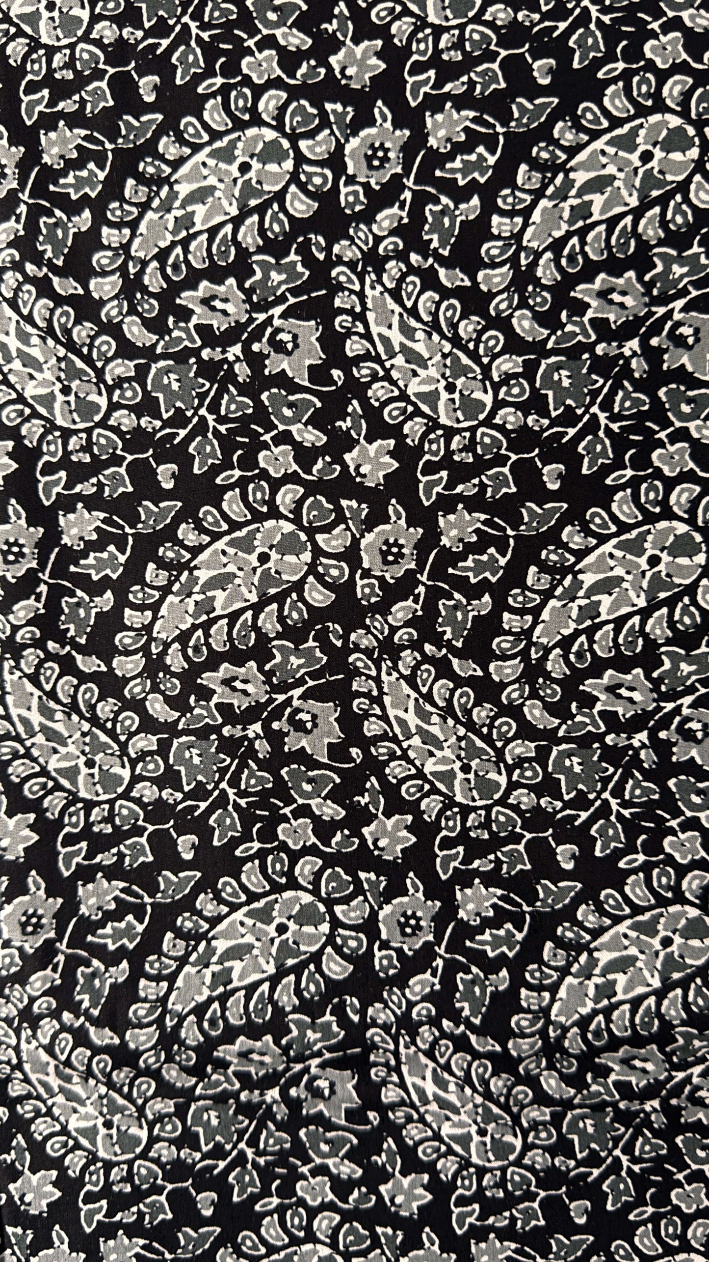 Black background with white floral pattern