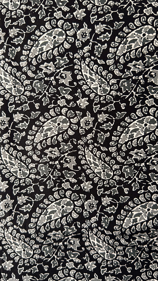 Black background with white floral pattern