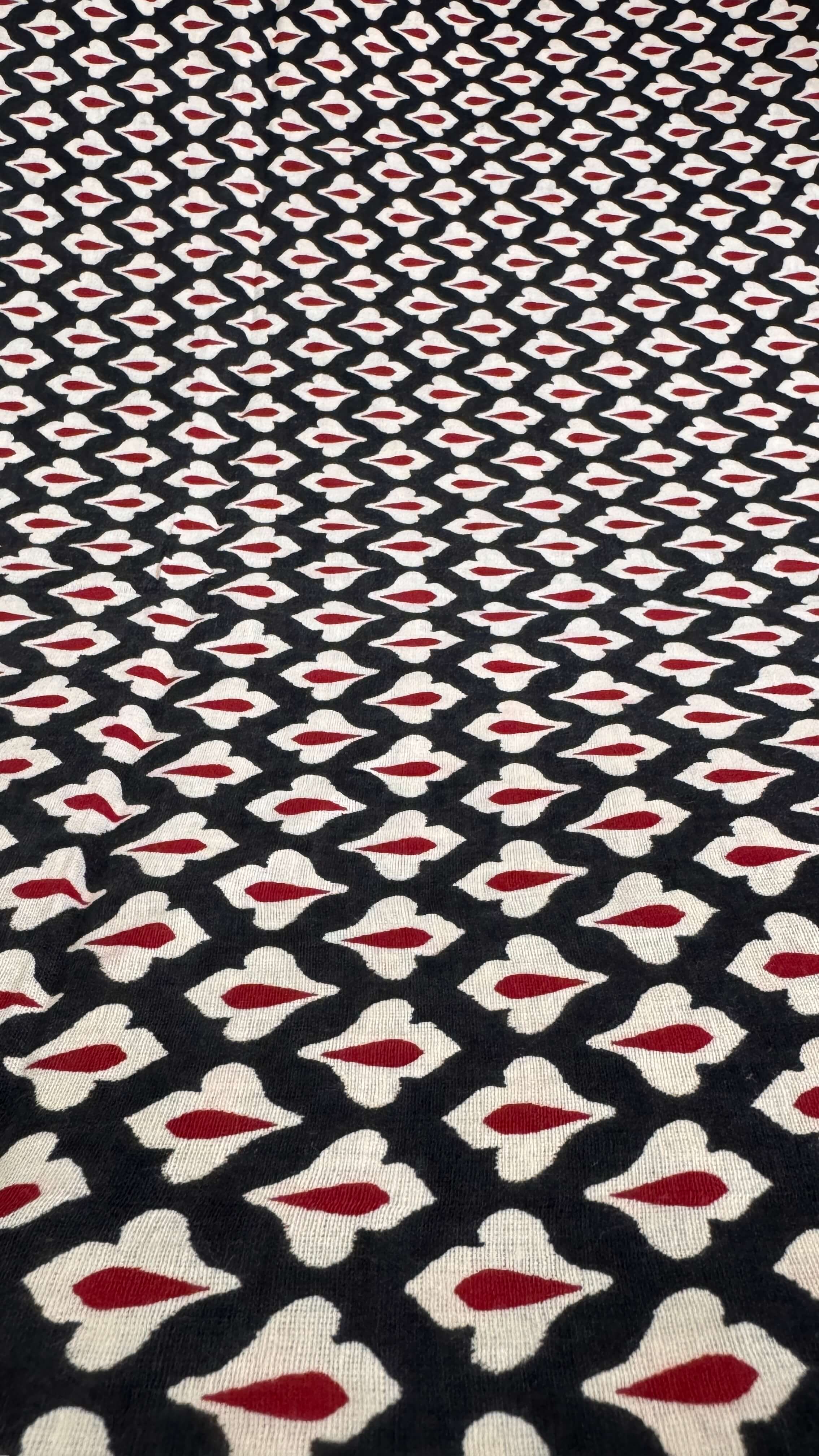 Patterned fabric with red, white, and black design
