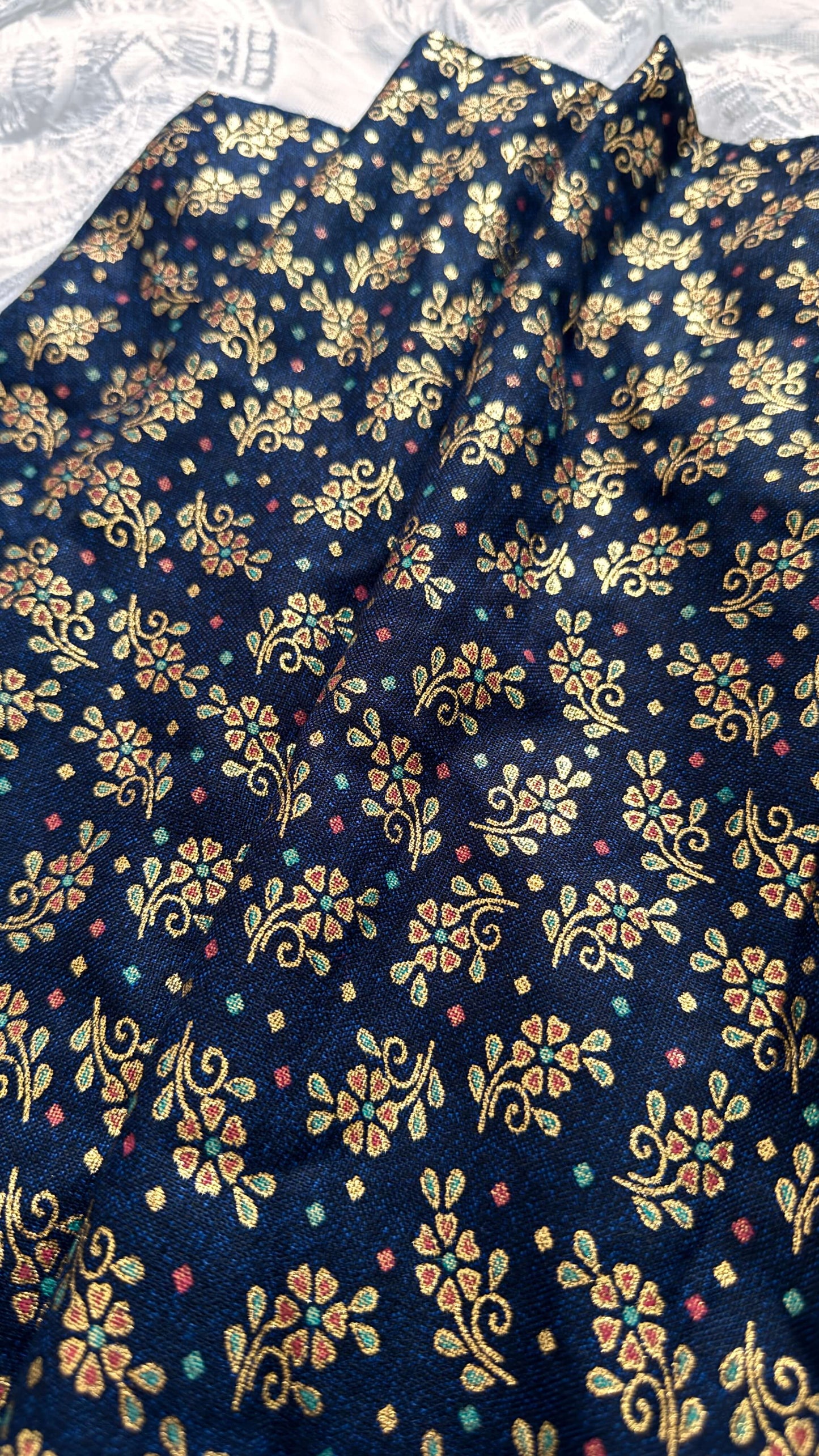 Navy blue fabric with gold floral pattern