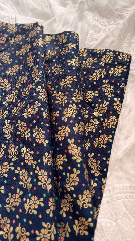 Navy blue fabric with floral pattern on a white background