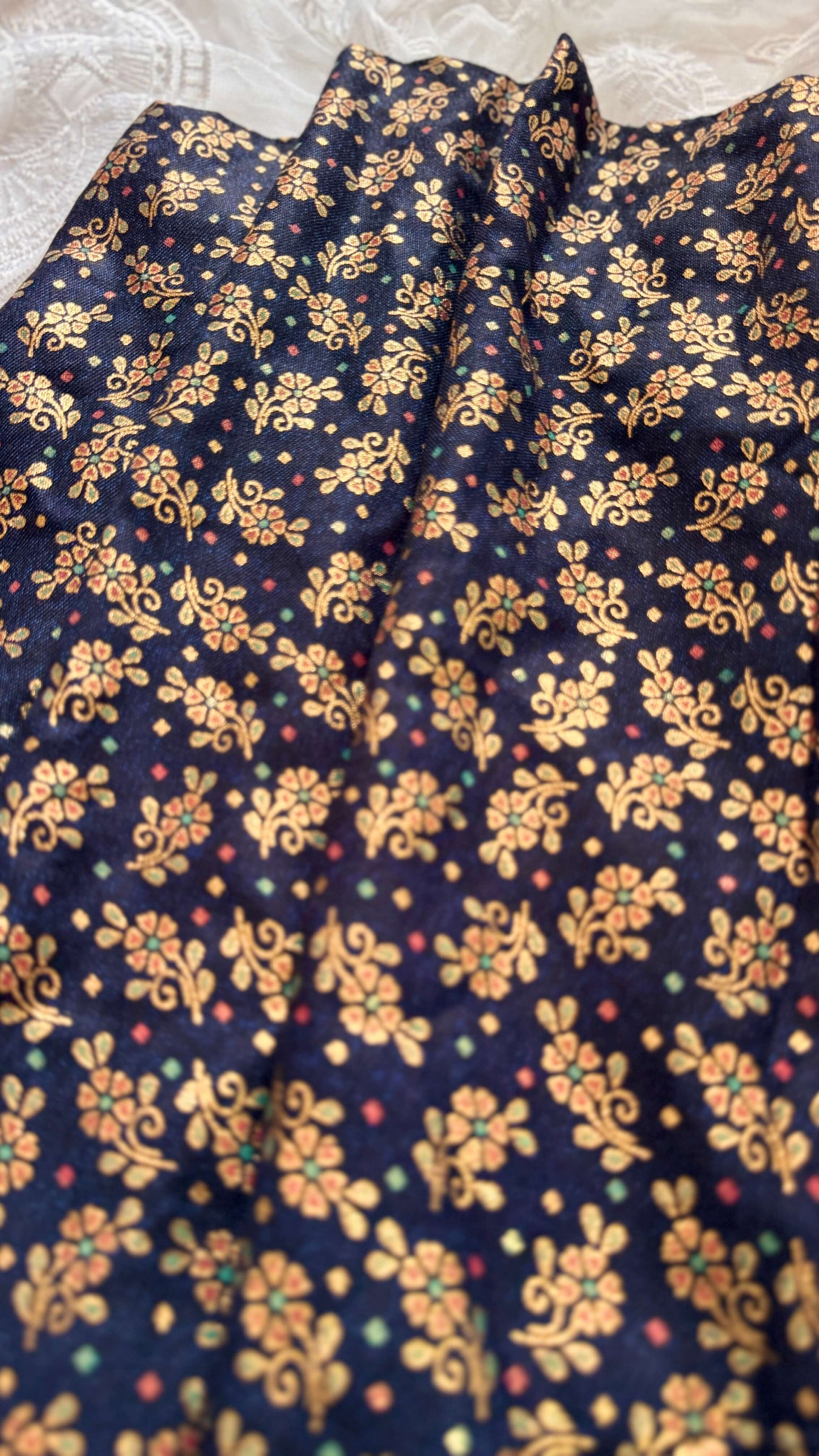 Navy blue fabric with gold floral pattern