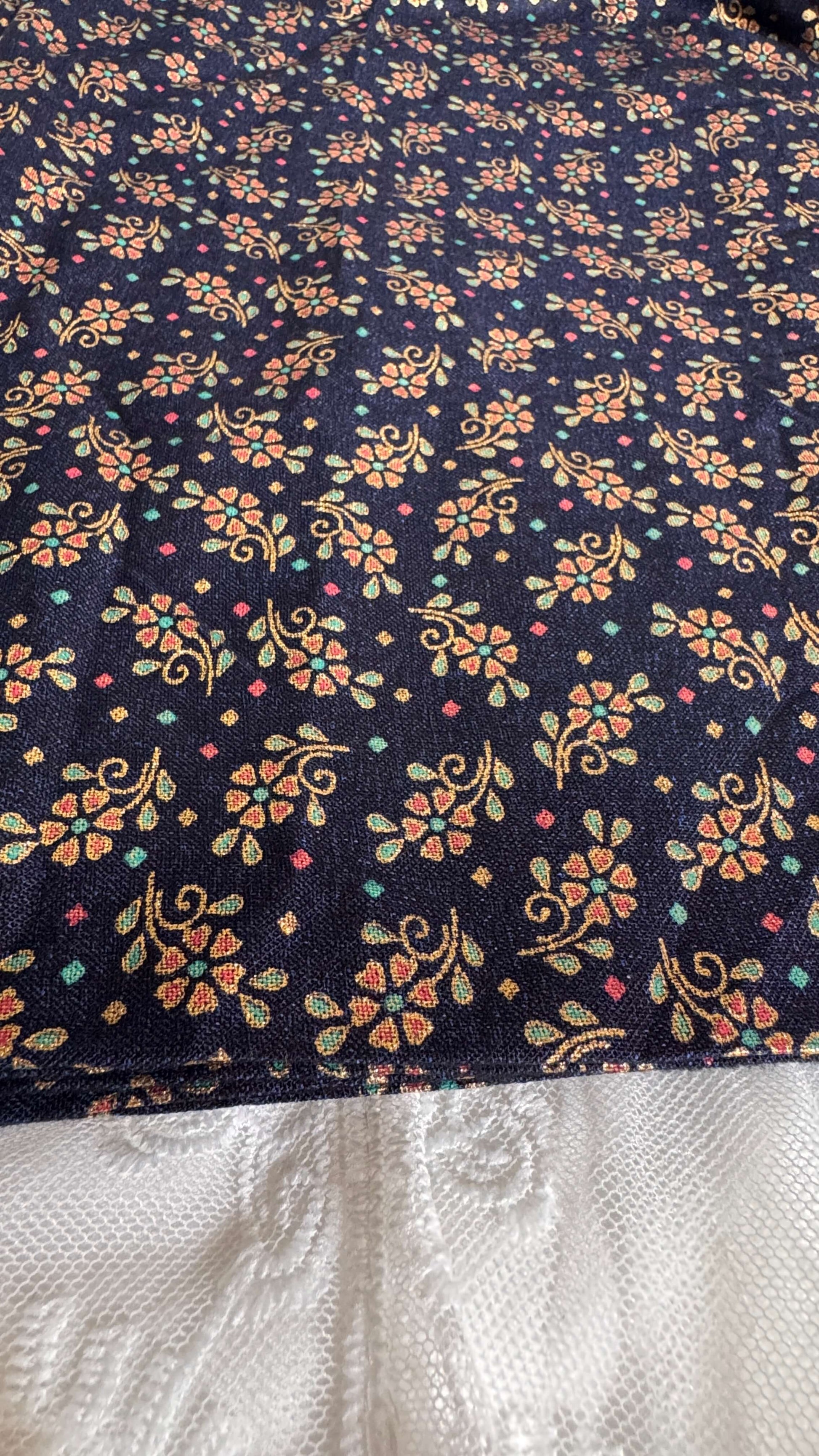 Floral patterned fabric with a dark background