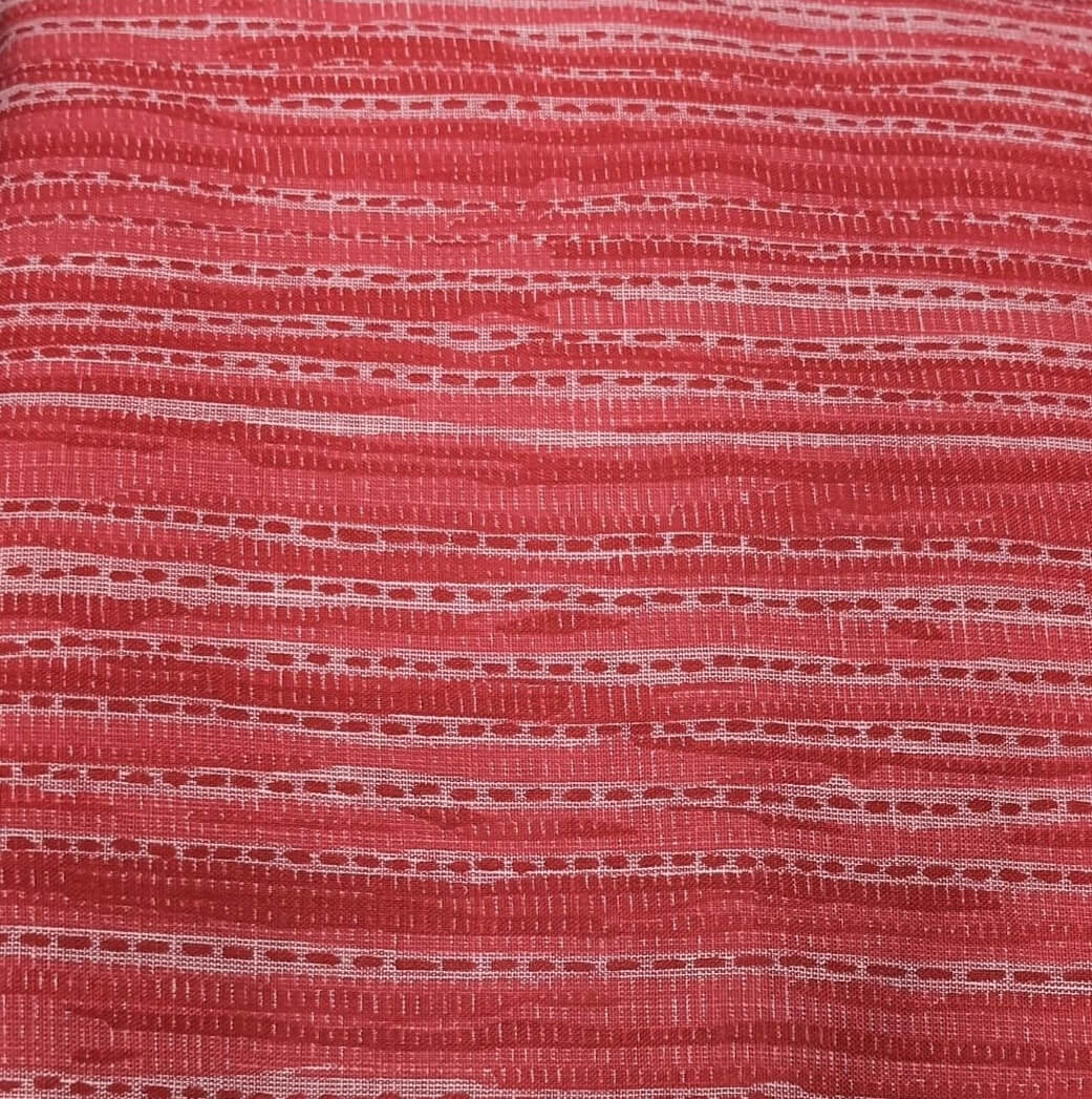 Close-up of red fabric with a textured pattern
