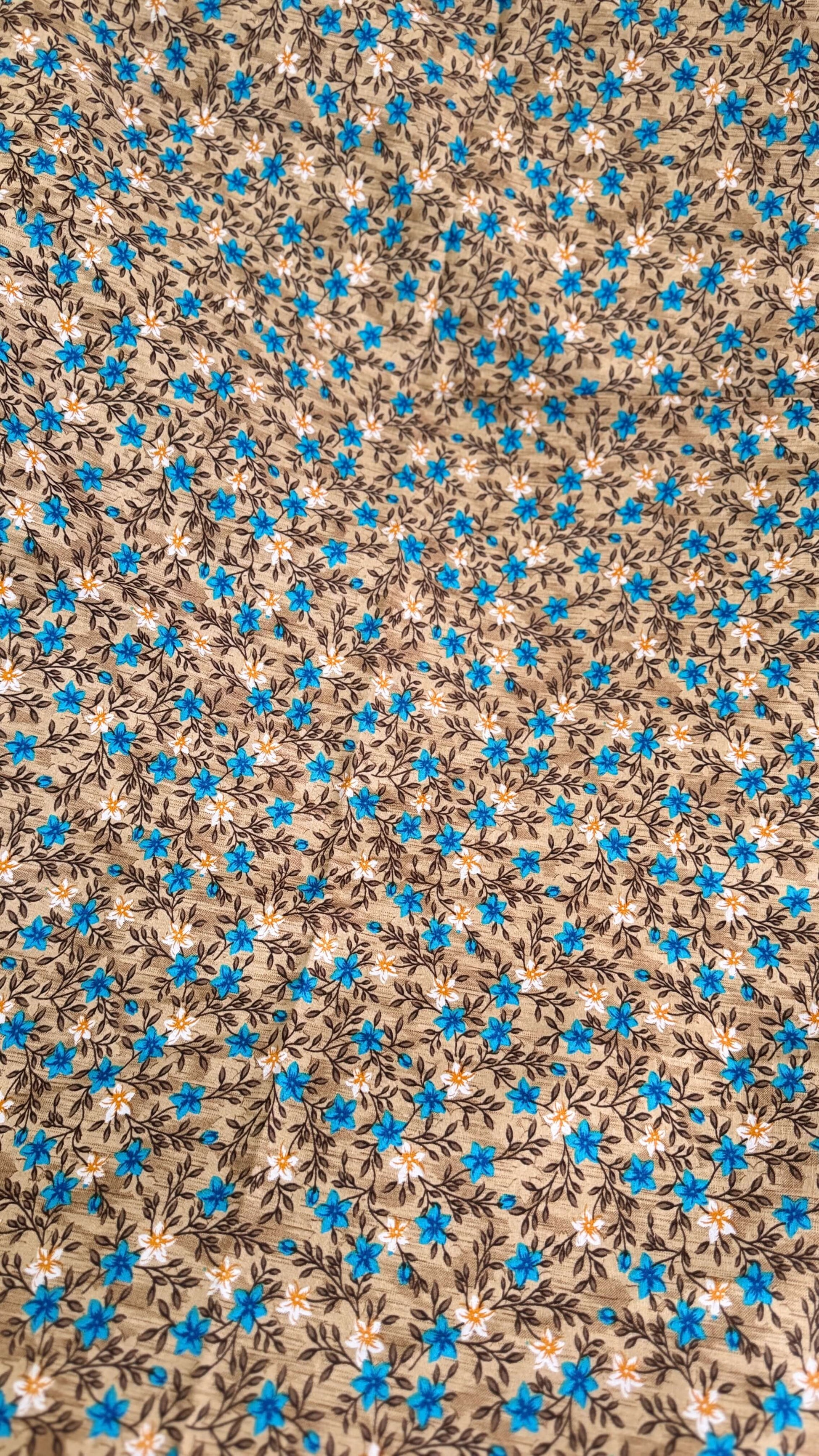Floral pattern with blue flowers on a brown background