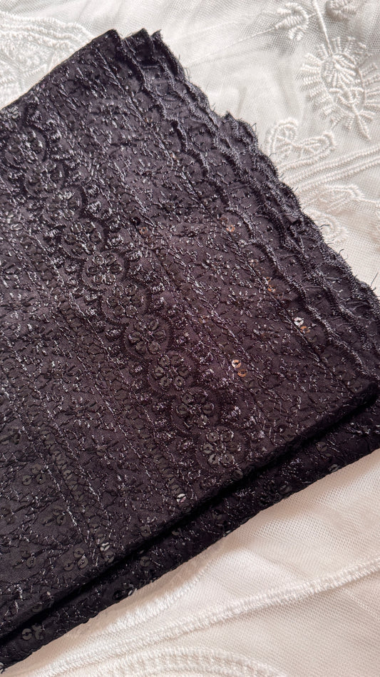 Dark textured fabric on a light background