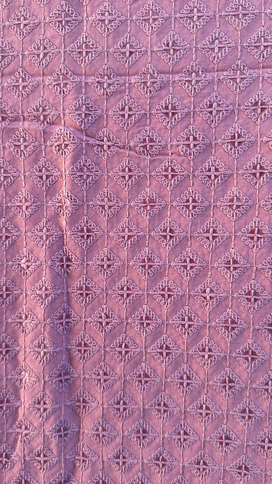 Patterned fabric with a diamond grid design in shades of purple.