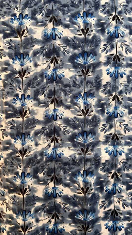 Patterned fabric with blue and black floral design on a beige background, floral trellis cotton fabric