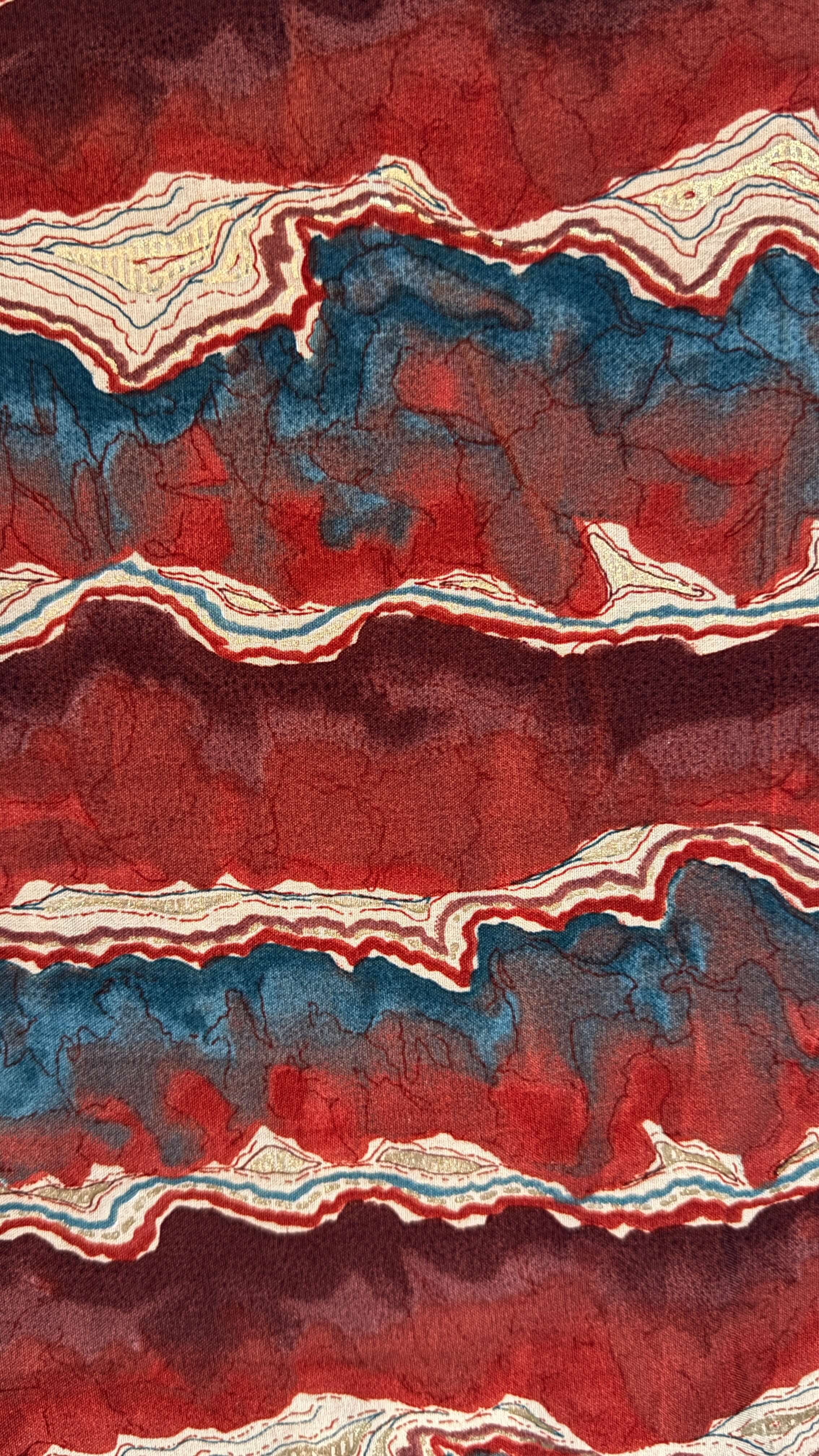 Artistic depiction of layered rock or mineral formation with red, blue, and white colors.