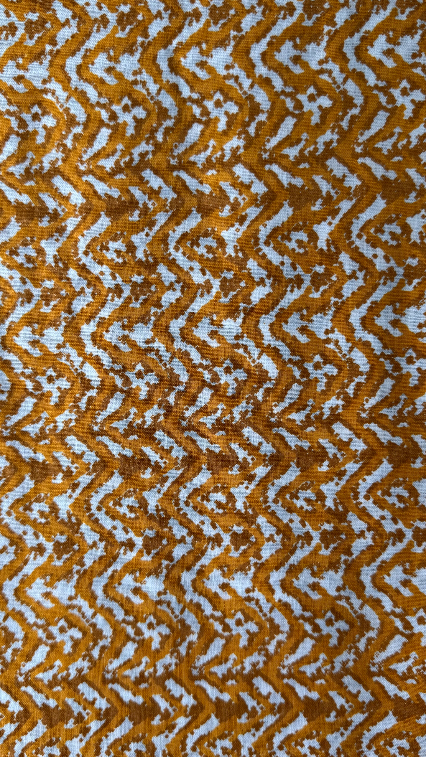 Patterned fabric with wavy brown and white design