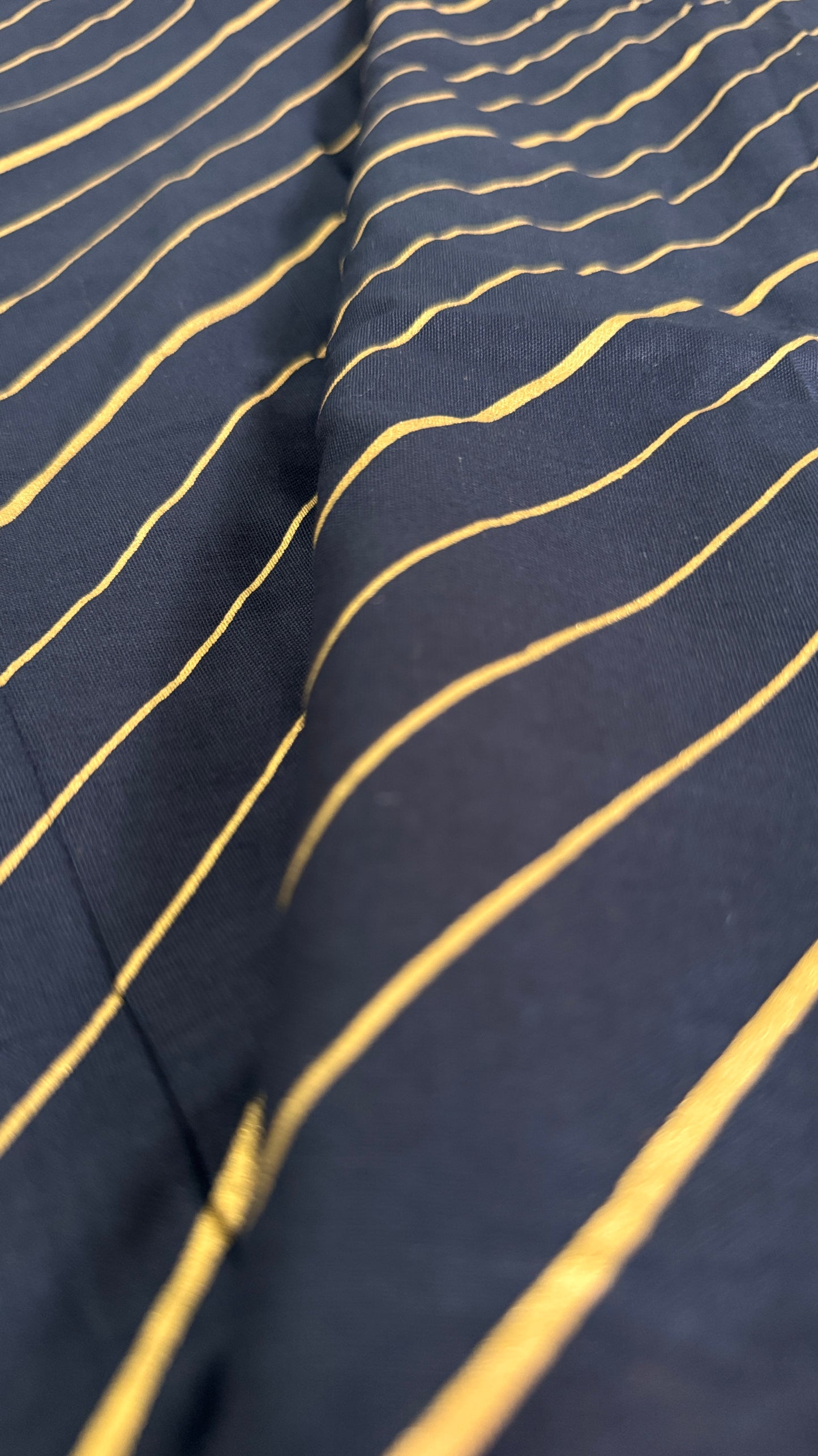 Navy fabric with gold wavy lines
