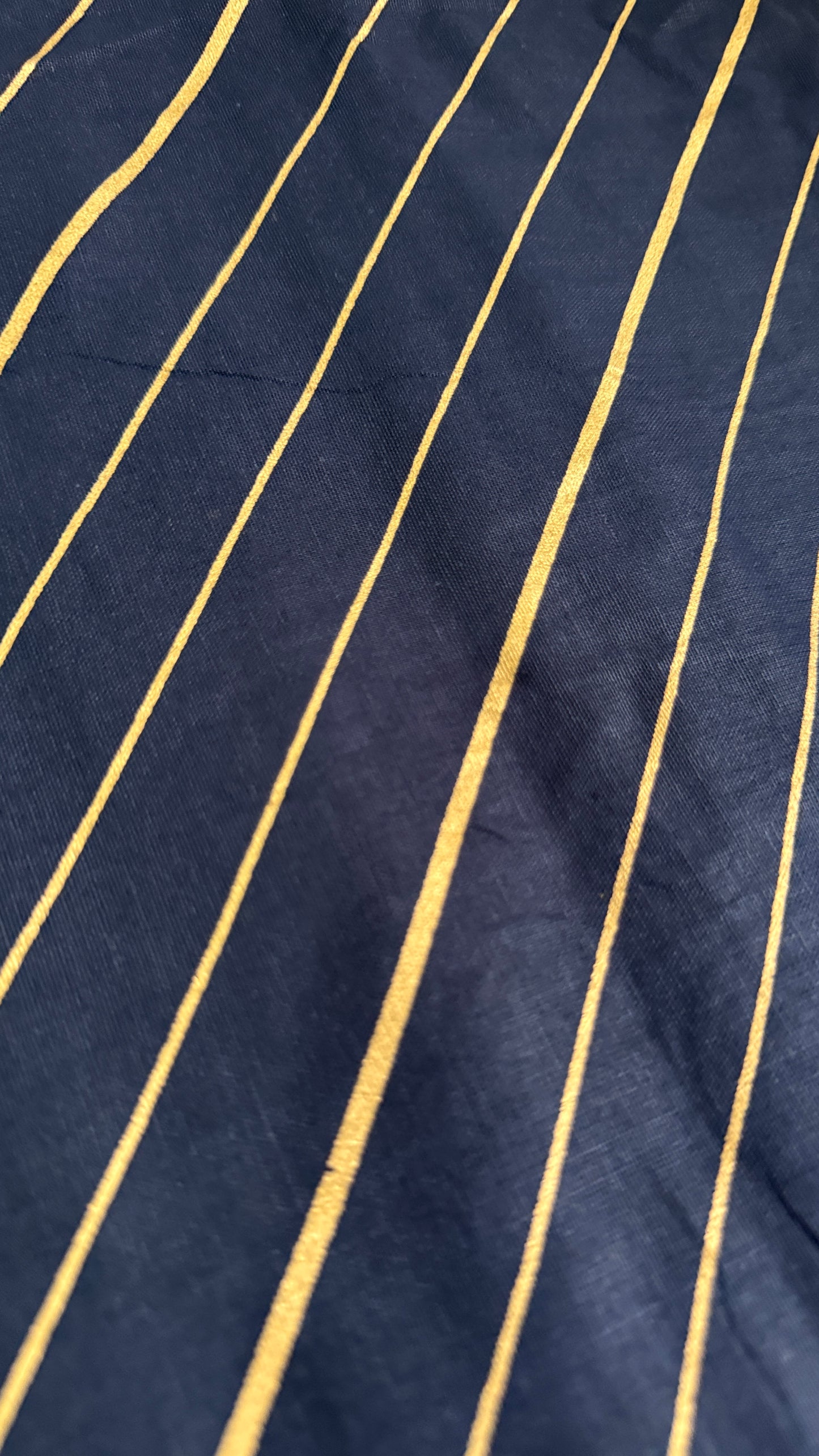 Navy fabric with gold pinstripes