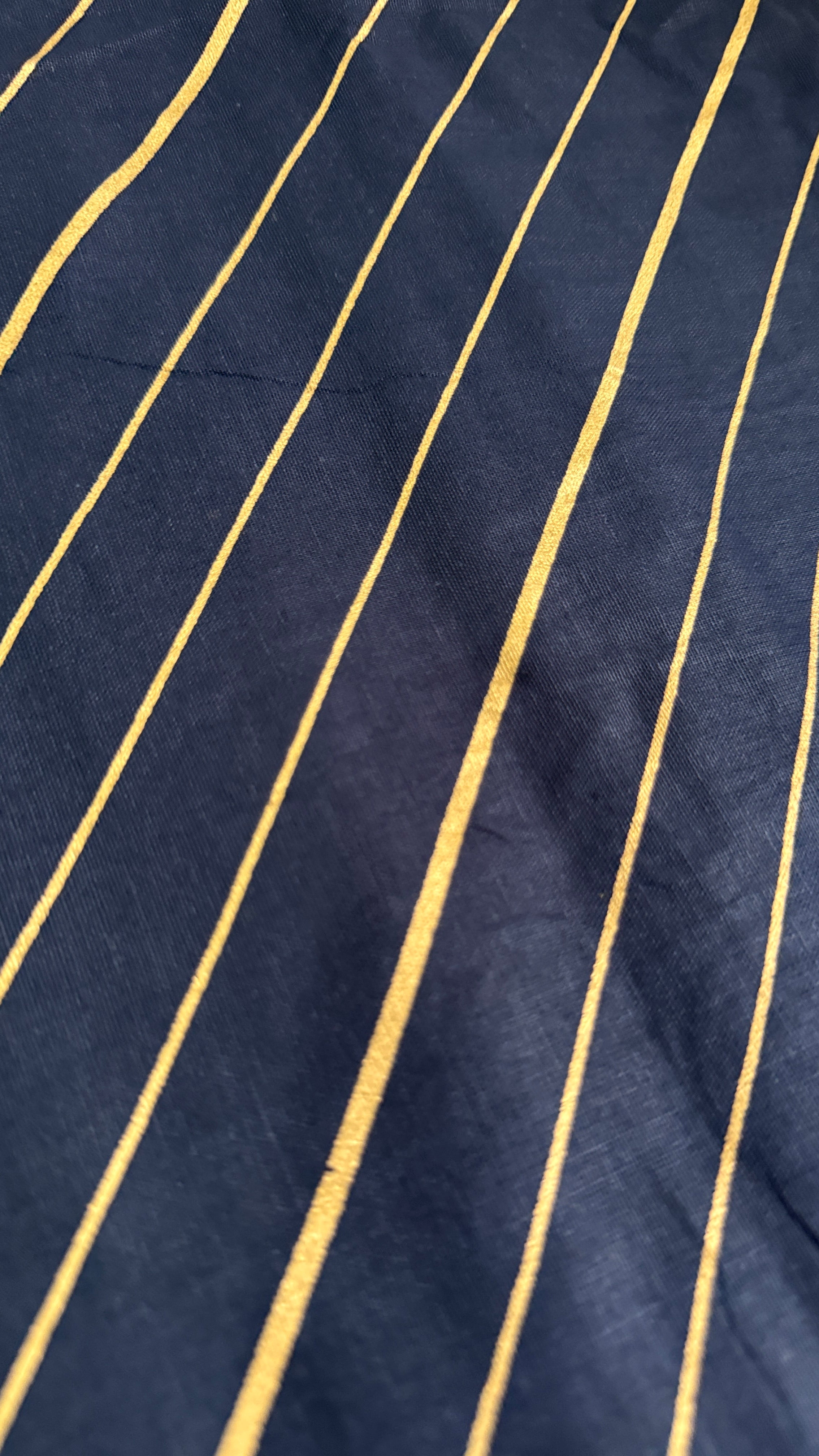 Navy fabric with gold pinstripes