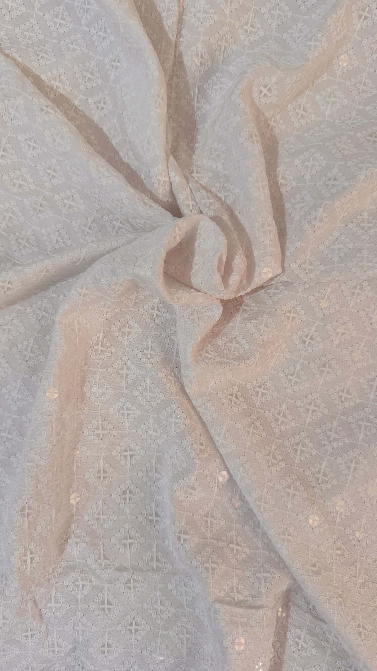 Close-up of textured fabric with a neutral color palette