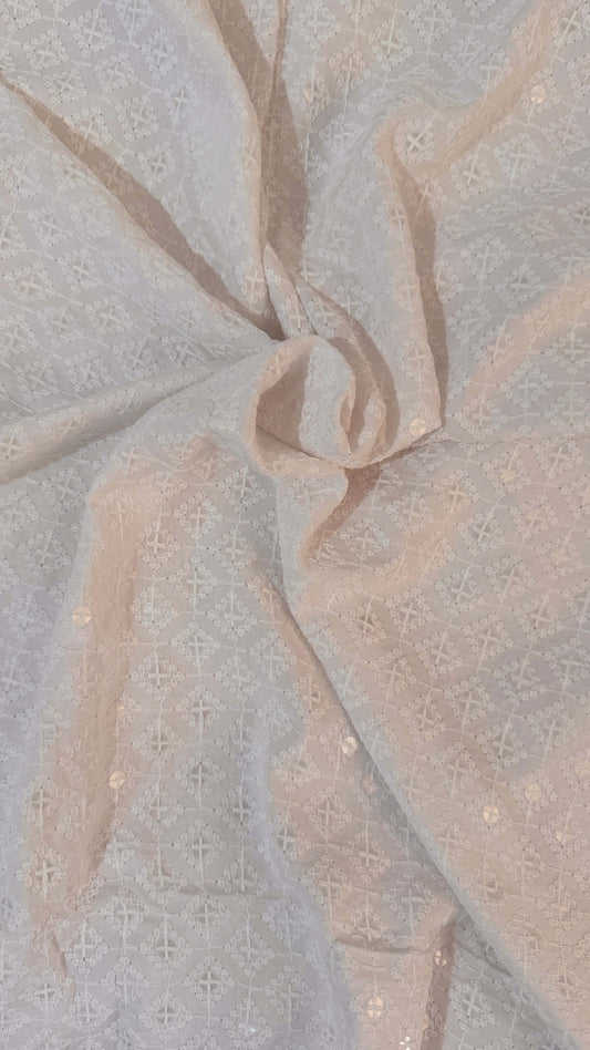 Close-up of textured fabric with a neutral color palette