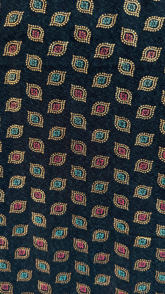 Navy blue tie with a pattern of colorful geometric shapes