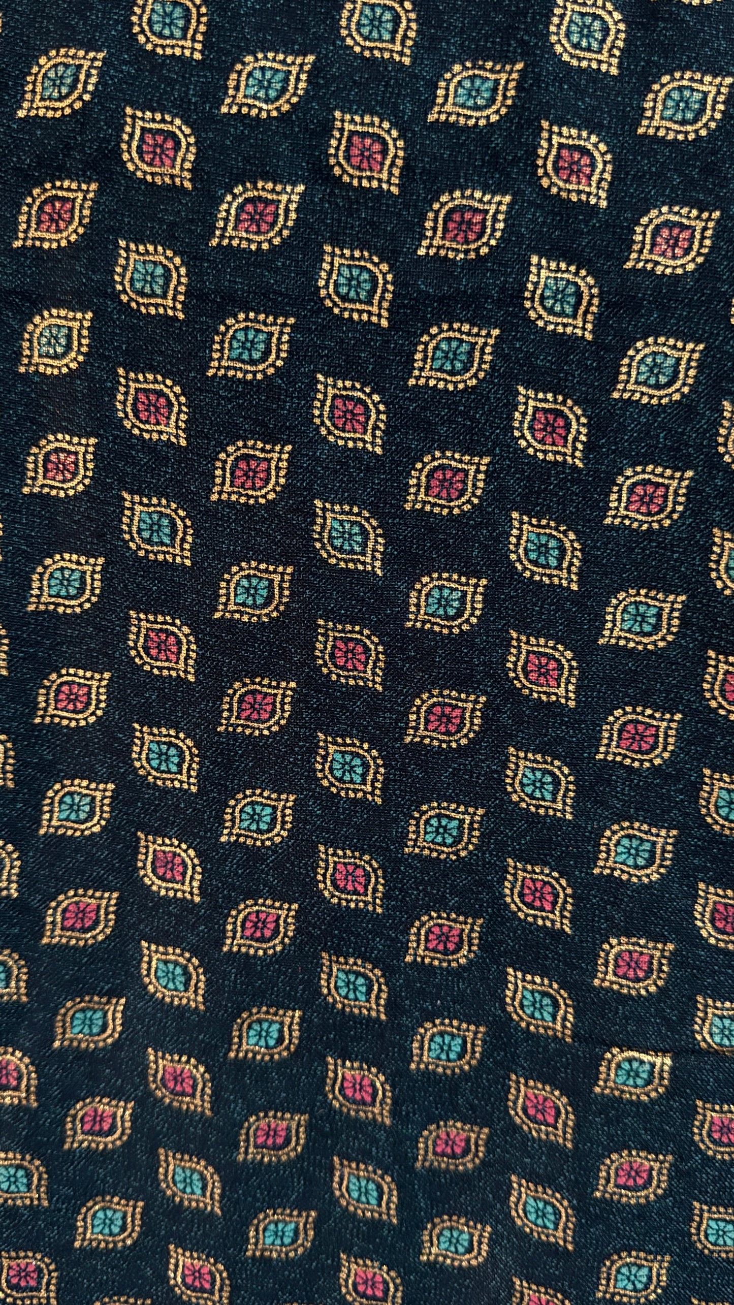 Navy blue tie with a pattern of colorful geometric shapes