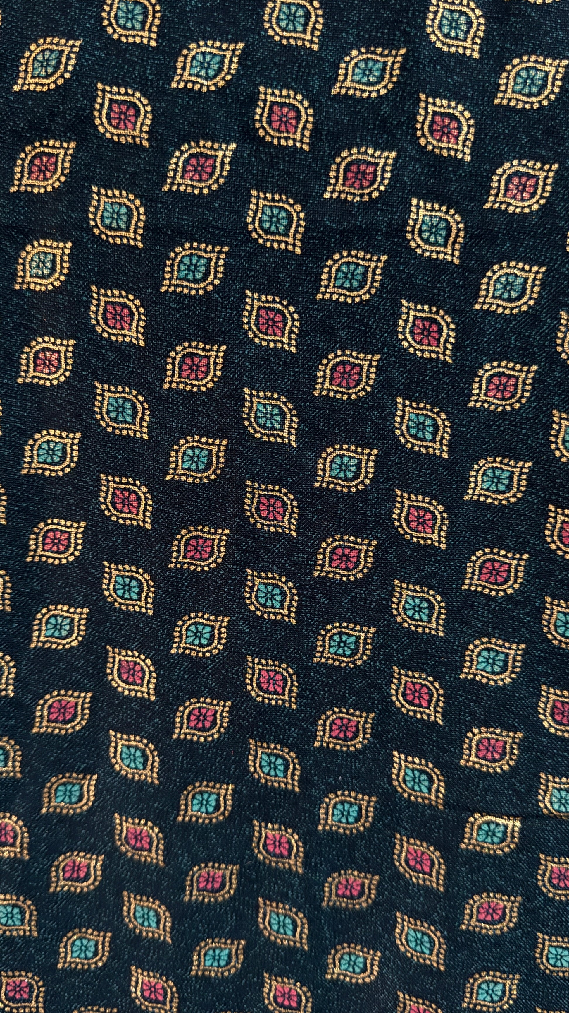 Navy blue tie with a pattern of colorful geometric shapes