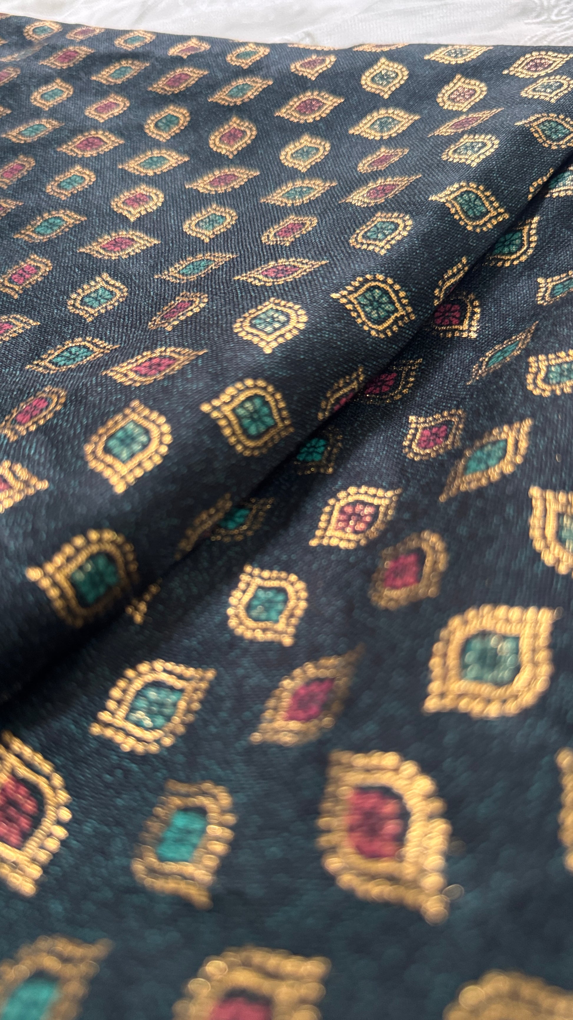 Patterned fabric with geometric design on a dark background
