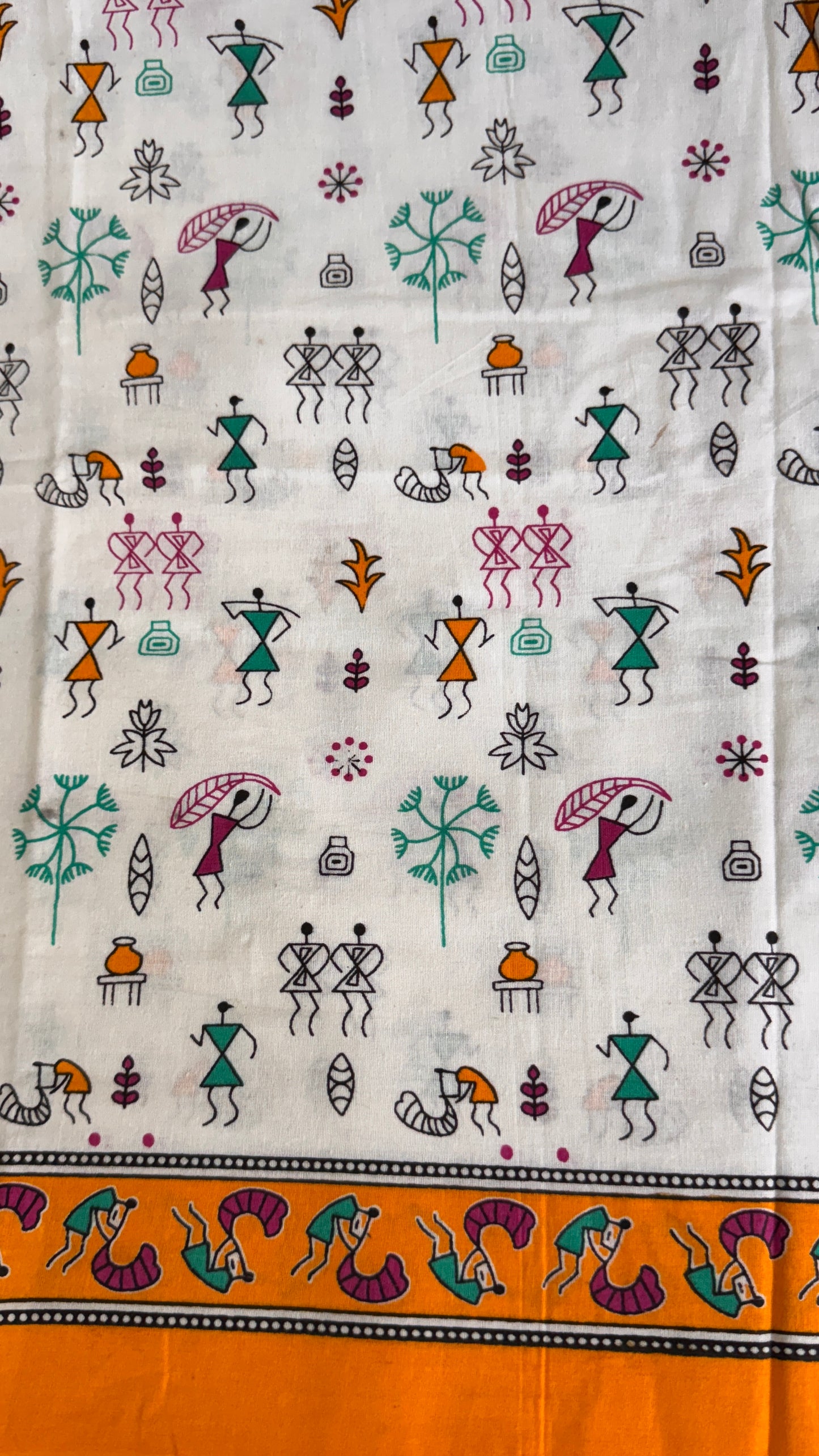 Textile with colorful patterns of people and animals on a white background