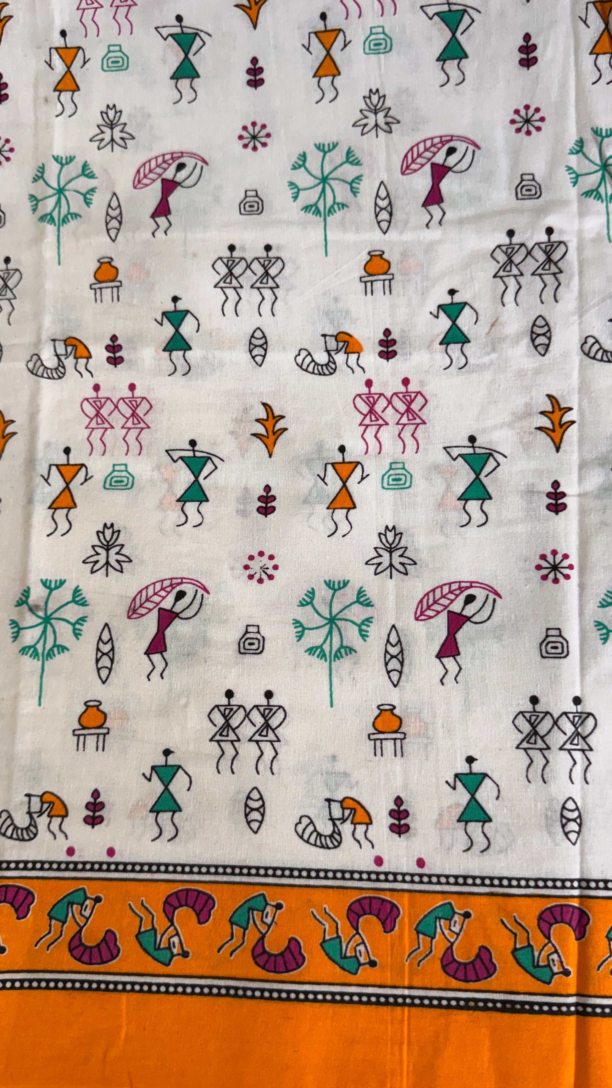 Textile with colorful patterns of people and animals on a white background
