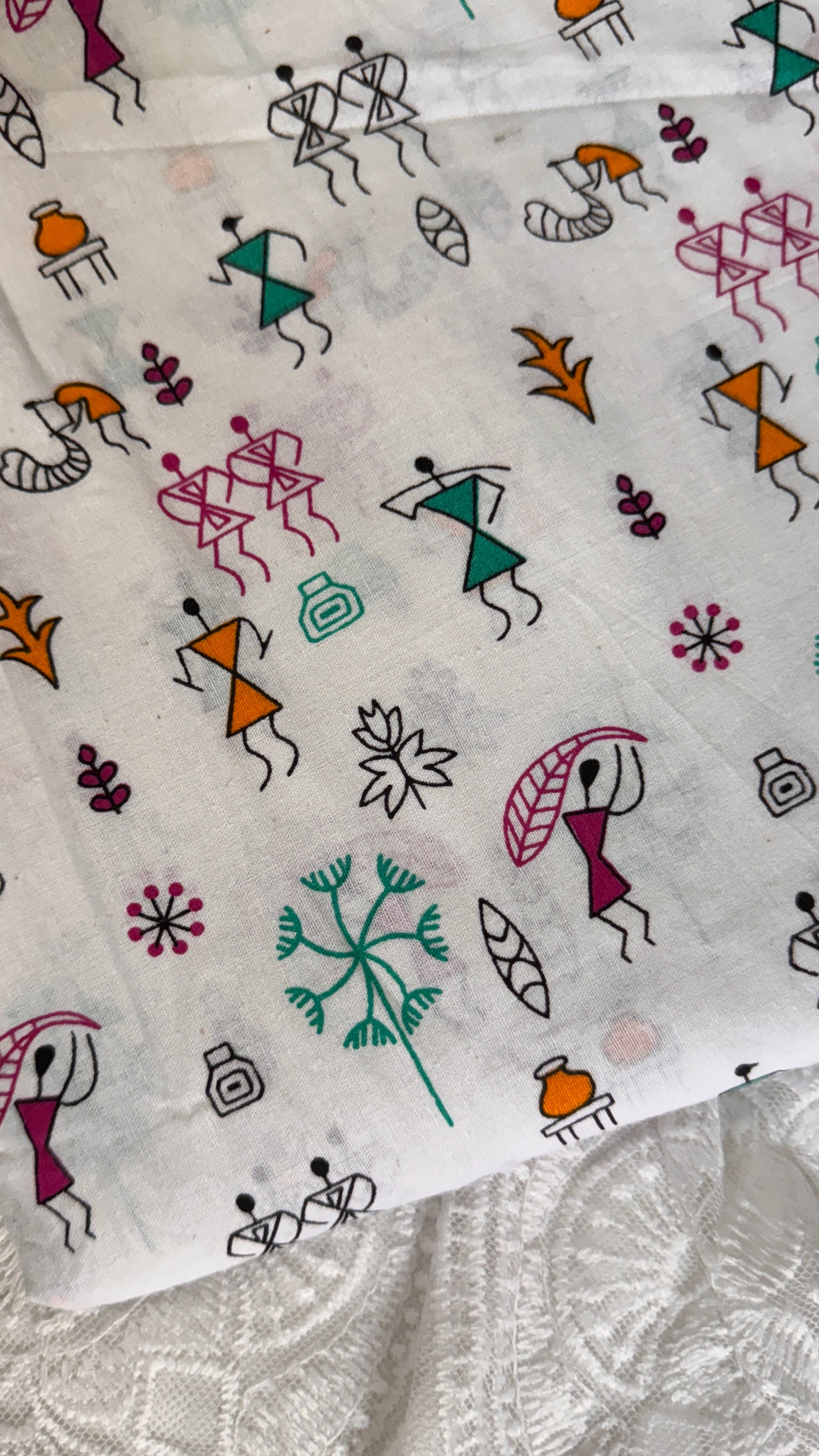 Patterned fabric with abstract figures and shapes on a white background