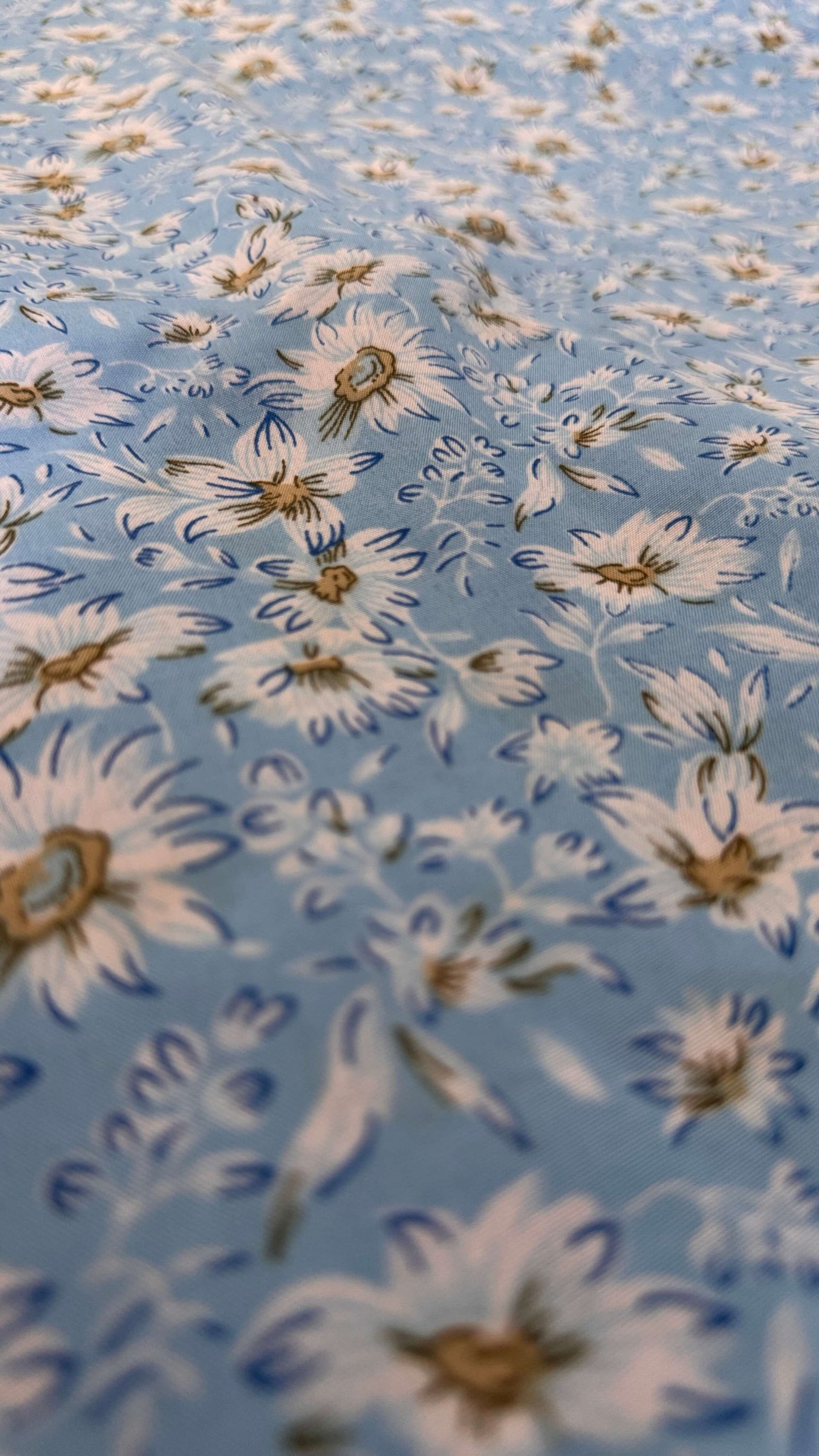 Floral pattern with white flowers on a blue background