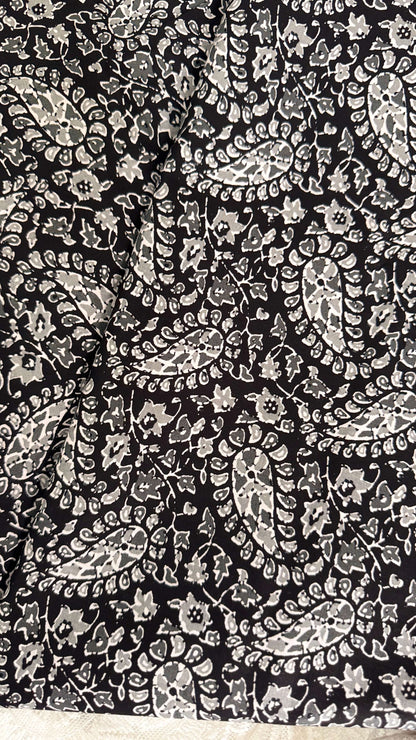Black fabric with white paisley pattern