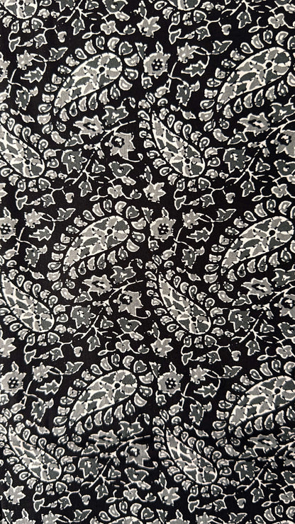 Black background with white floral pattern
