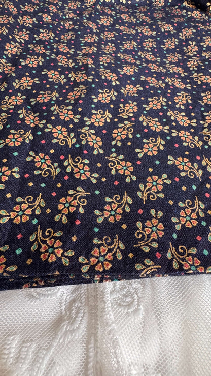 Floral patterned fabric with a dark background
