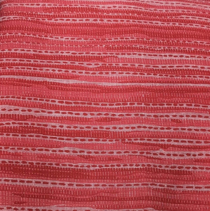 Close-up of red fabric with a textured pattern