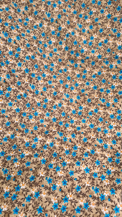Floral pattern with blue flowers on a brown background
