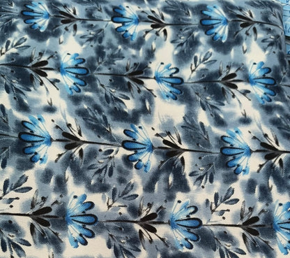Floral pattern with blue and black flowers on a textured background