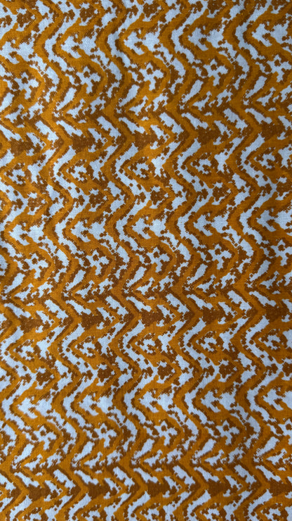 Patterned fabric with wavy brown and white design