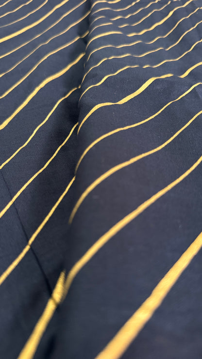 Navy fabric with gold wavy lines