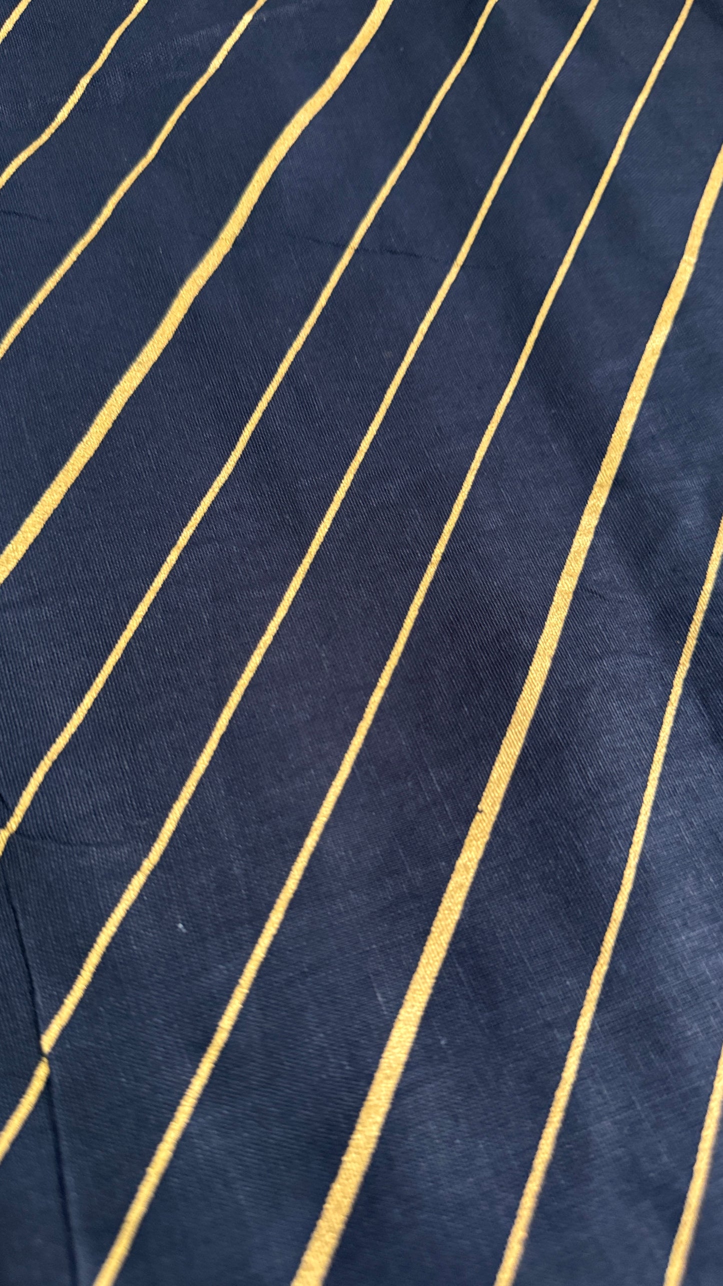 Navy fabric with gold pinstripes
