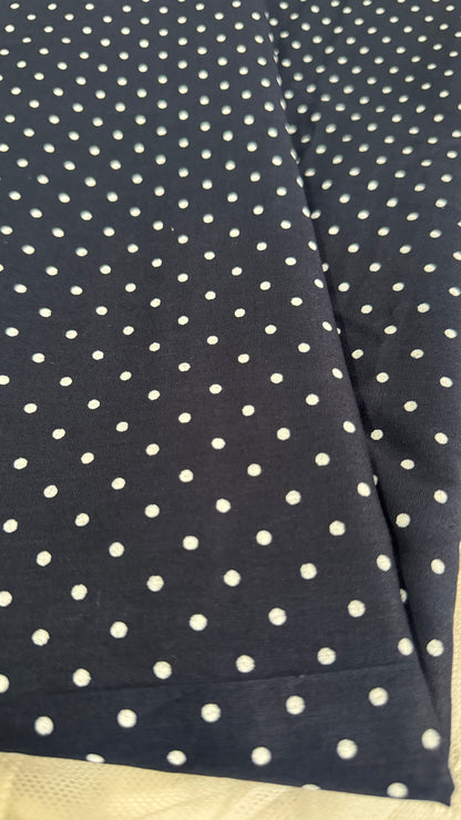 Navy blue fabric with white polka dots