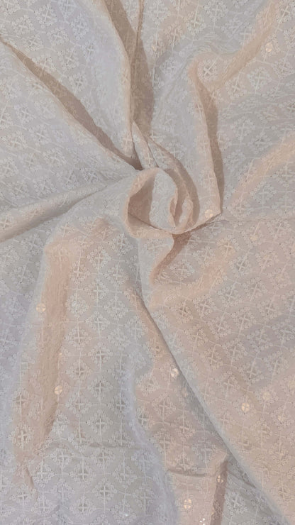 Close-up of textured fabric with a neutral color palette