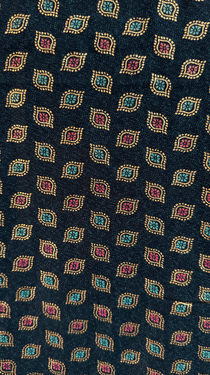 Navy blue tie with a pattern of colorful geometric shapes