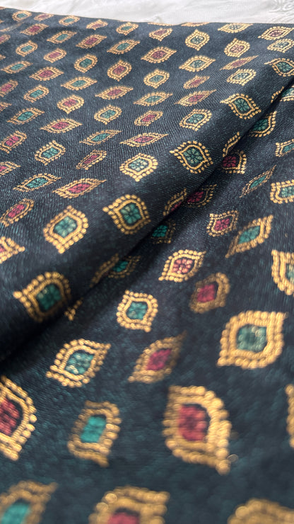 Patterned fabric with geometric design on a dark background